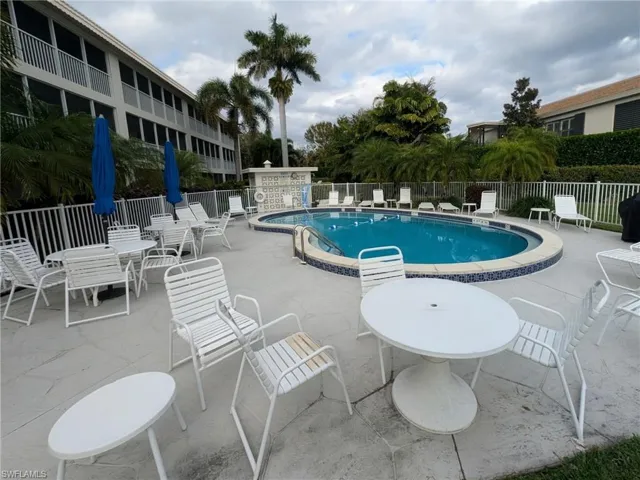 Community pool with a patio area