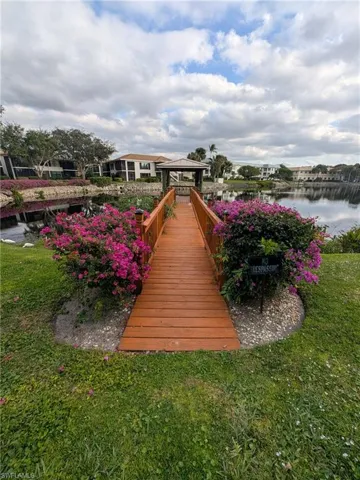 Dock featuring a gazebo and a water view