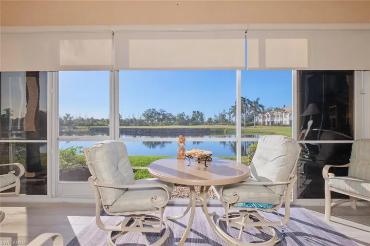 Sunroom / solarium with a water view