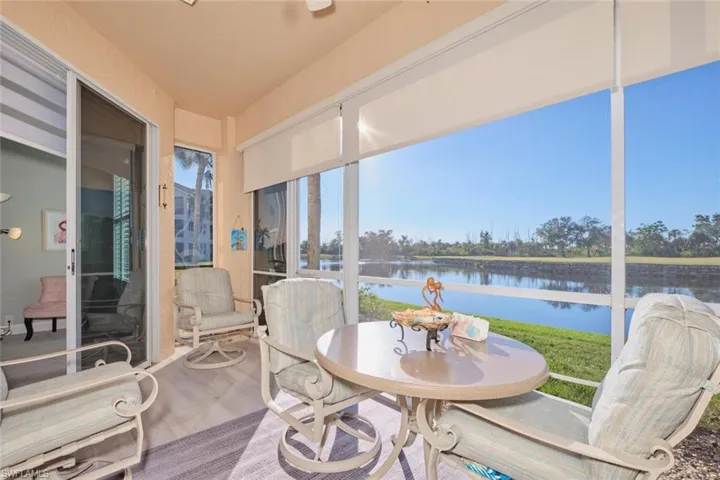 Sunroom / solarium with a water view