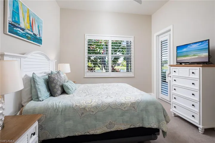 Bedroom featuring carpet flooring and a ceiling fan