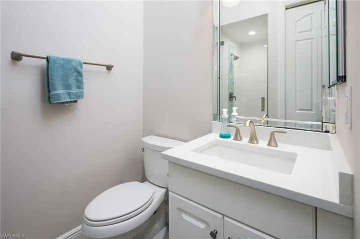 Bathroom with vanity and a shower stall