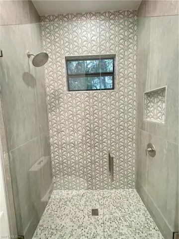 Bathroom featuring tiled shower