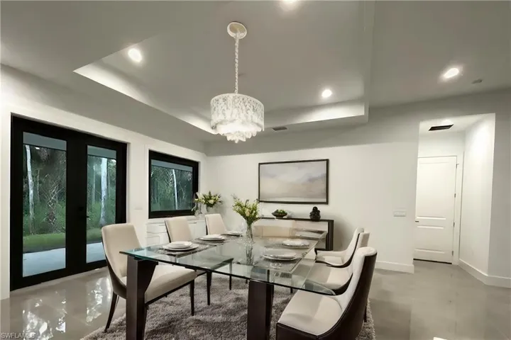 Dining room featuring an inviting chandelier and french doors