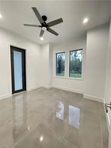 Unfurnished room featuring ceiling fan