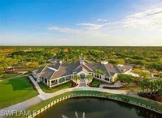 Aerial view of Clubhouse featuring a water view