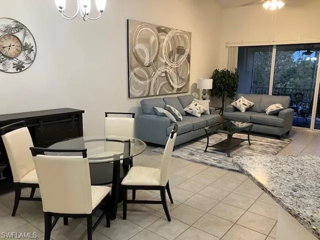 Dining room featuring a chandelier and light tile patterned flooring