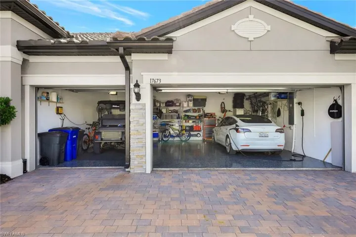 large 3 car garage with 4ft extension Tesla charger can stay