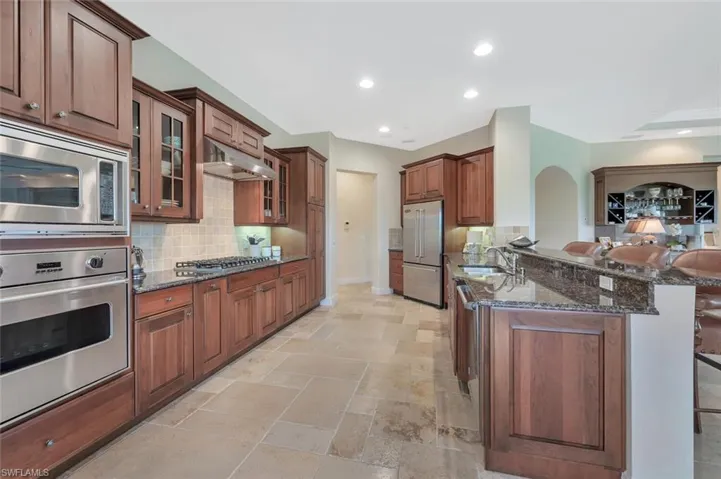 Gas cooktop & commercial hood.