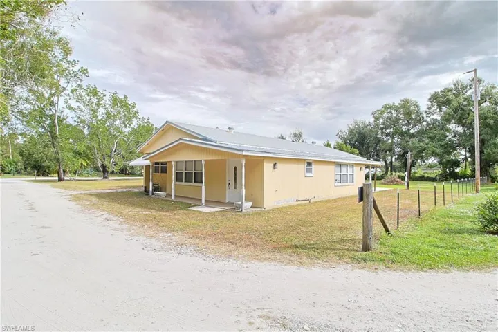 View of property exterior with a patio
