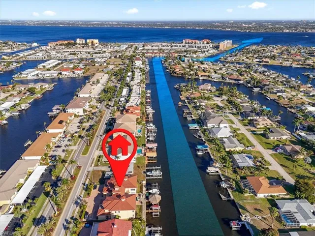 Aerial perspective of suburban area with a large body of water