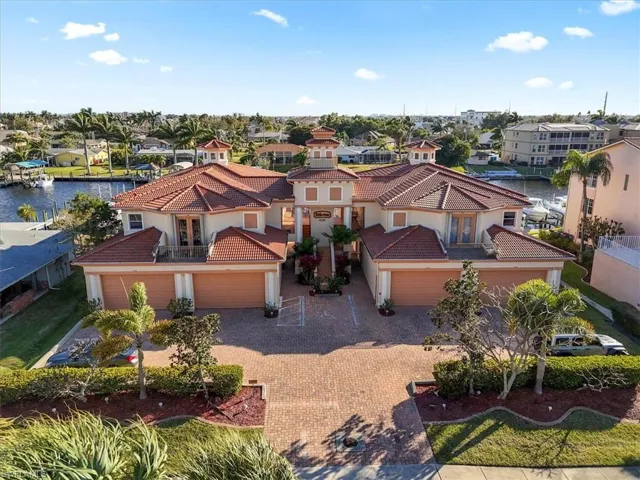 Aerial perspective of suburban area with a large body of water