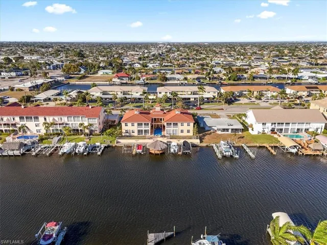 Aerial view of property's location featuring a nearby body of water