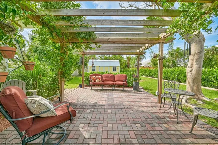 View of patio / terrace featuring a pergola and an outdoor hangout area