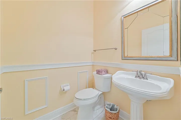 Bathroom with toilet and tile patterned flooring