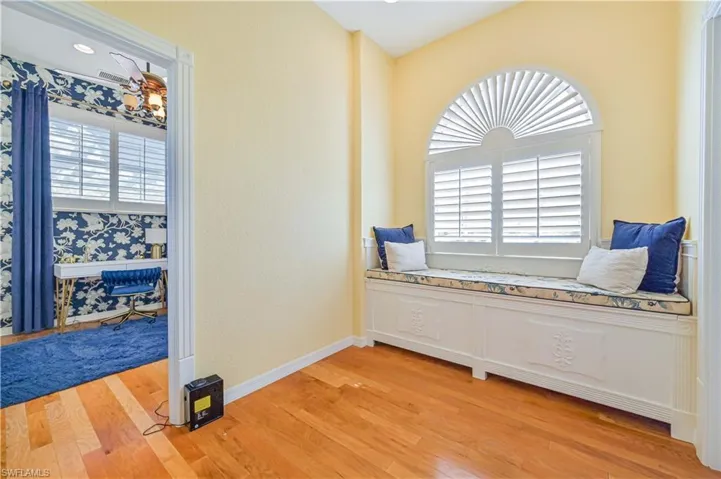 Sitting room with light hardwood / wood-style flooring and plenty of natural light