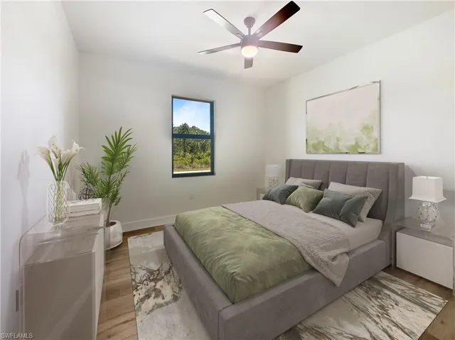 Bedroom with light hardwood / wood-style flooring and ceiling fan