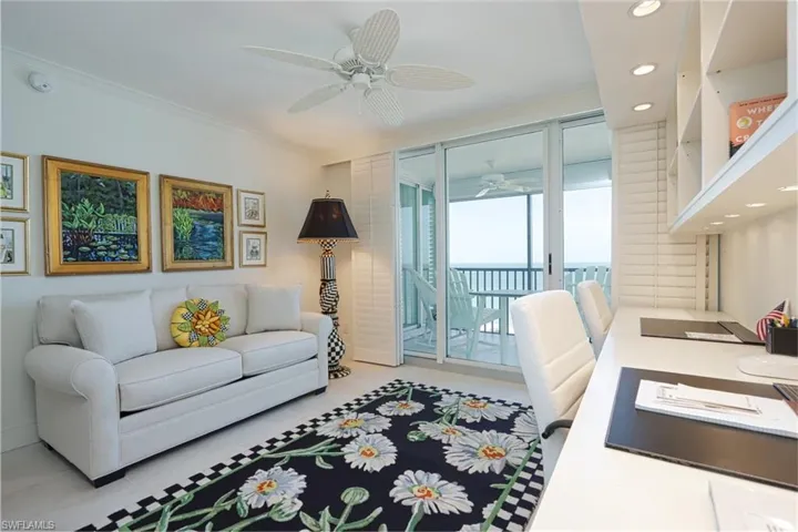 Living room with ornamental molding, ceiling fan, a water view, and recessed lighting