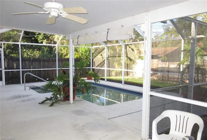 View of swimming pool with a fenced in pool, a patio, ceiling fan, a lanai, and a fenced backyard