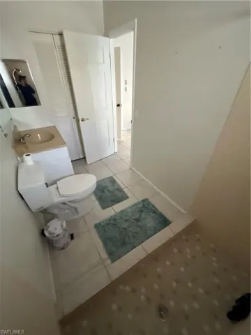 Bathroom with tile patterned flooring and a sink