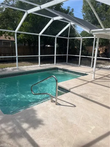 View of pool with a patio area, a fenced in pool, and a fenced backyard