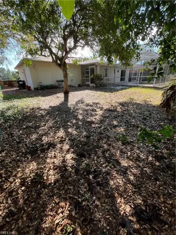 Back of house with fence