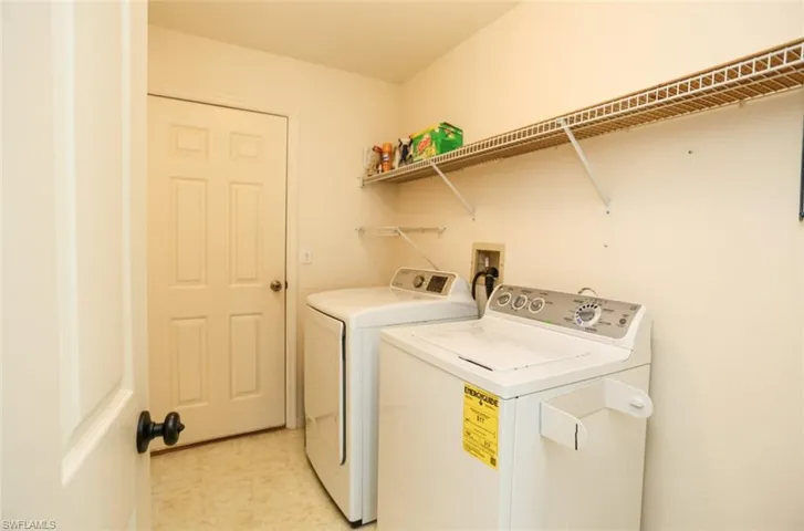 Clothes washing area featuring independent washer and dryer