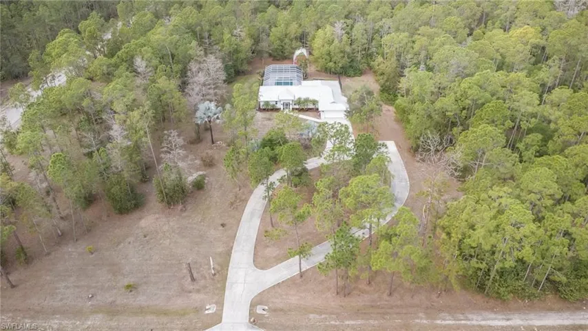 View from above of property featuring a forest