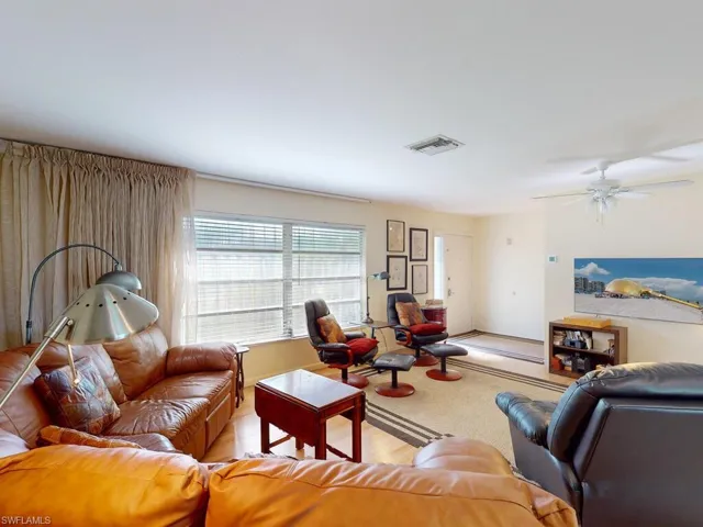 Living room featuring ceiling fan