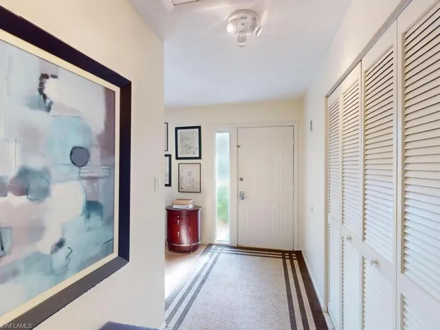 View of carpeted entrance foyer