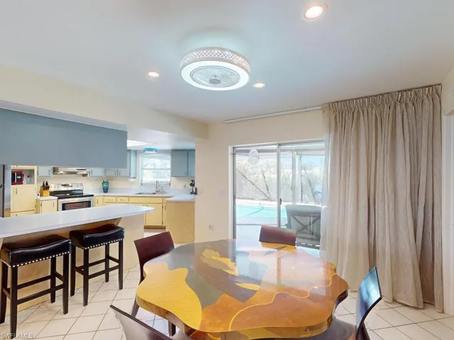 Tiled dining space with sink