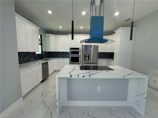 Kitchen with light tile patterned floors