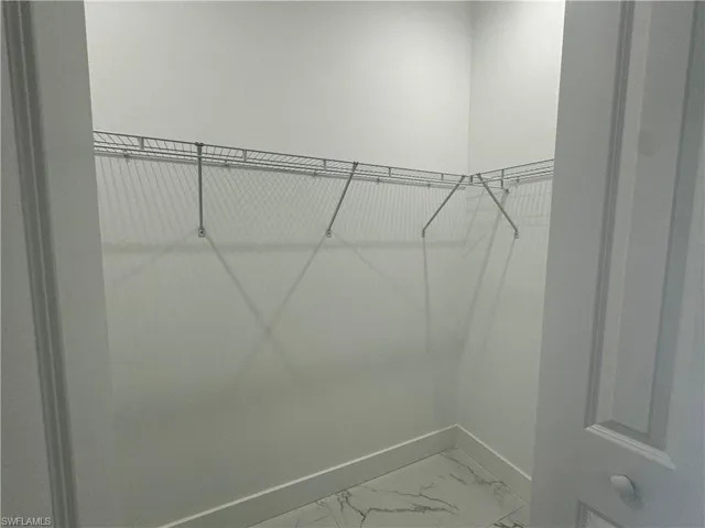 Spacious "her's" Closet