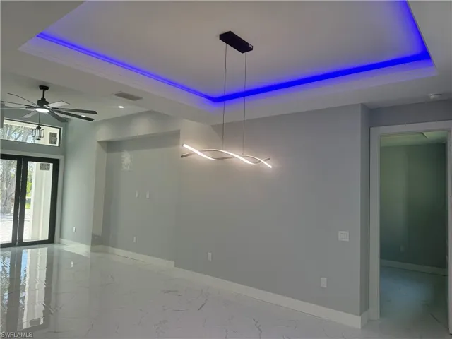 Dining area with unique LED lights, and modern light fixtures