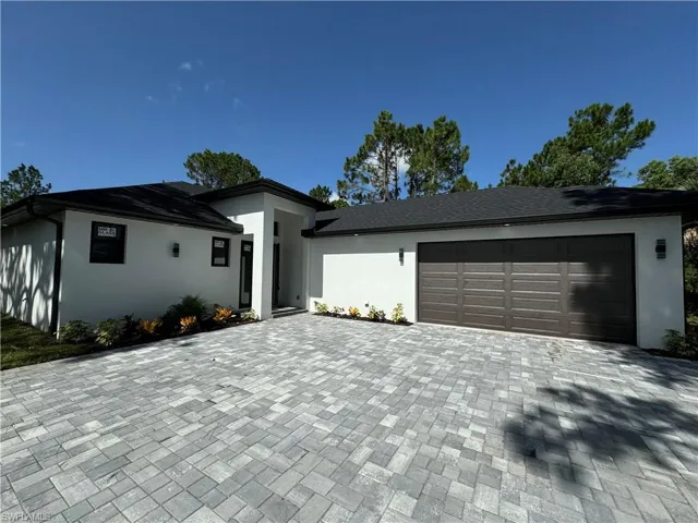 View of front of house featuring a 2 car garage