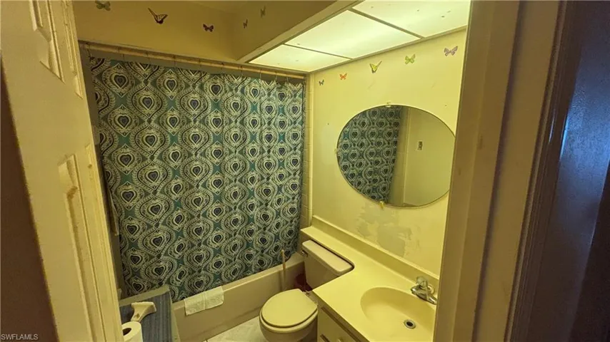 Bathroom featuring vanity and shower / bath combo