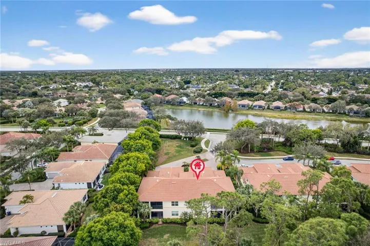 View of property location with nearby suburban area and a nearby body of water