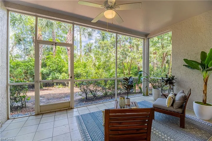 Sunroom featuring a ceiling fan and an outdoor hangout area
