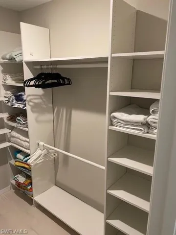 Walk in closet featuring light hardwood / wood-style flooring
