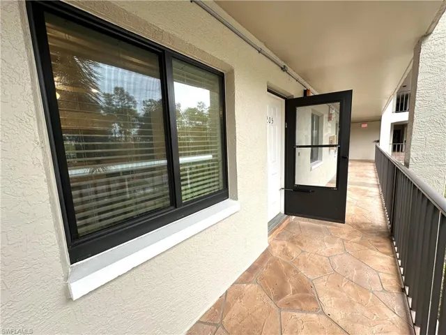 View of exterior entry featuring stucco siding