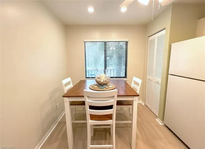 Dining area featuring light wood-style floors, recessed lighting, and a ceiling fan