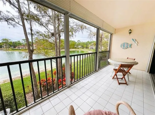 Sunroom / solarium with a water view