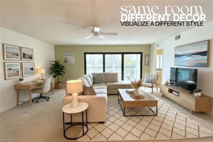 Carpeted living room with ceiling fan and an office area