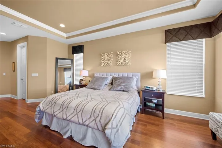 Hall to left leads to walk-in closets, master en-suite bath