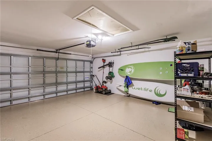 Garage featuring a garage door opener