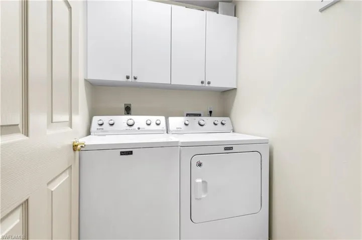 Laundry room with cabinets and independent washer and dryer