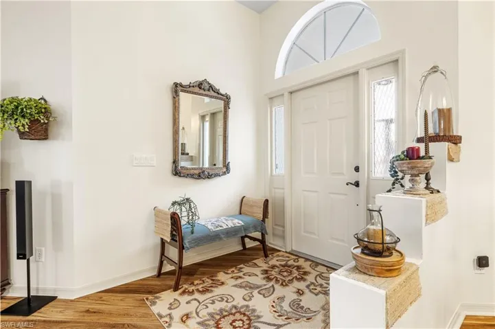 Foyer with light hardwood / wood-style floors