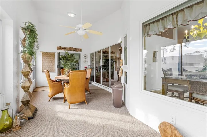 Sunroom with vaulted ceiling and ceiling fan