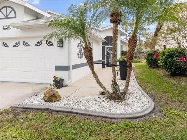 View of side of property featuring a garage