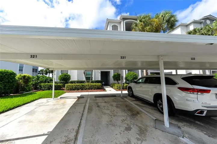 View of vehicle parking with a carport